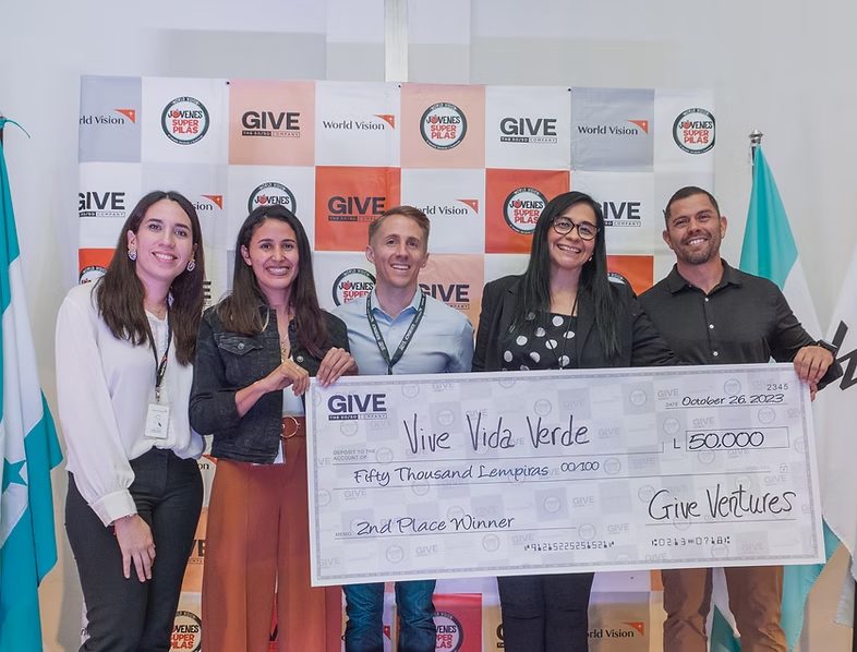 Robert Cardiff presenting a check from Give Ventures nonprofit
